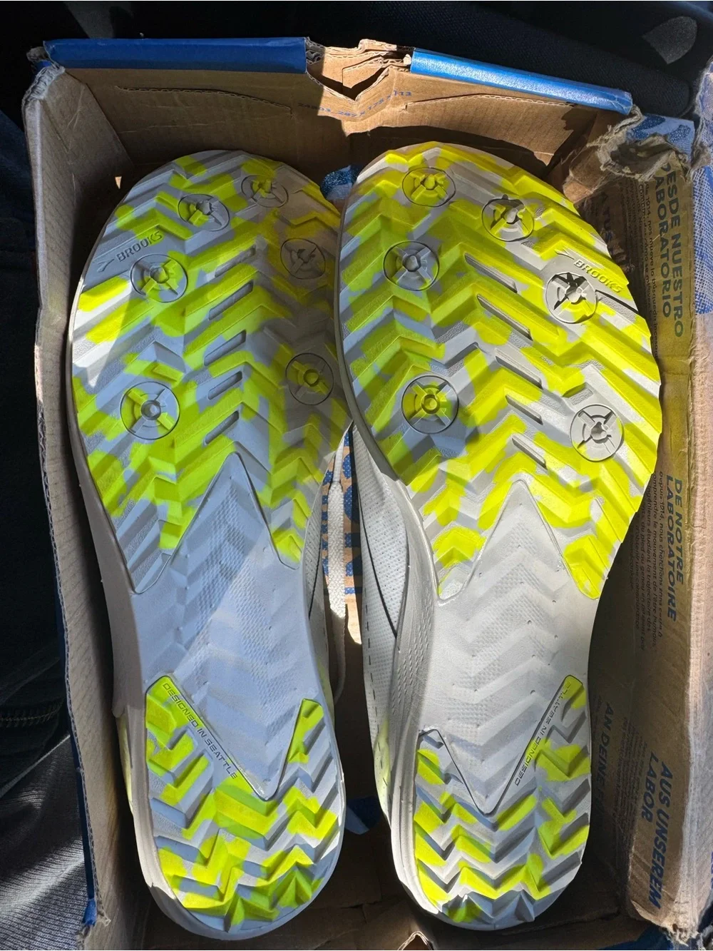 Brooks Unisex White Athletic Shoe with Neon Yellow Accents